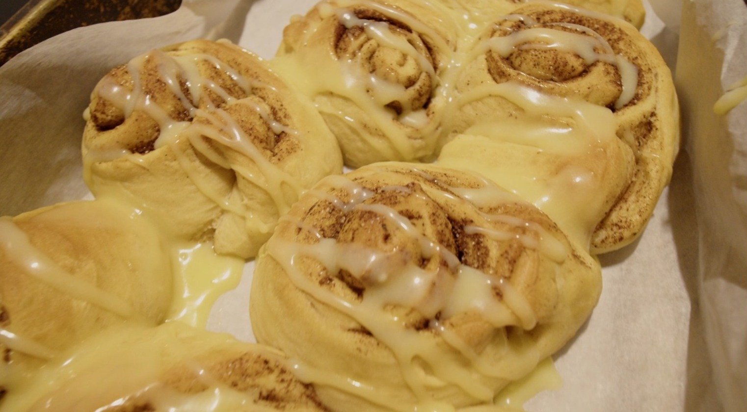 Finished cinnamon buns, glazed and fresh out of the oven